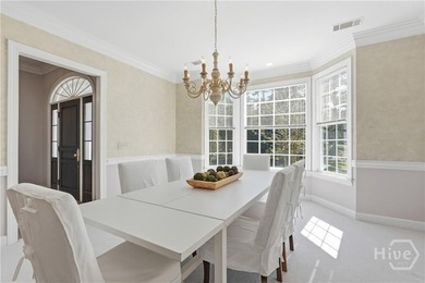Enjoy panoramic golf course and lagoon views from this beautiful on The Landings Club - Oakridge in Georgia - for sale on GolfHomes.com, golf home, golf lot