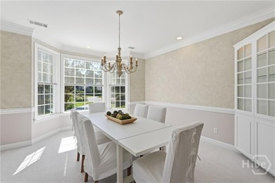 Enjoy panoramic golf course and lagoon views from this beautiful on The Landings Club - Oakridge in Georgia - for sale on GolfHomes.com, golf home, golf lot