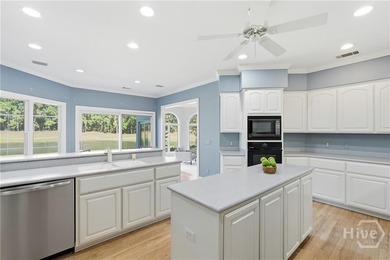 Enjoy panoramic golf course and lagoon views from this beautiful on The Landings Club - Oakridge in Georgia - for sale on GolfHomes.com, golf home, golf lot