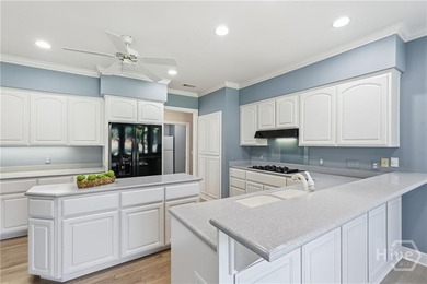 Enjoy panoramic golf course and lagoon views from this beautiful on The Landings Club - Oakridge in Georgia - for sale on GolfHomes.com, golf home, golf lot