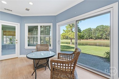 Enjoy panoramic golf course and lagoon views from this beautiful on The Landings Club - Oakridge in Georgia - for sale on GolfHomes.com, golf home, golf lot