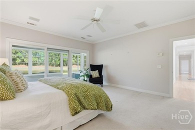 Enjoy panoramic golf course and lagoon views from this beautiful on The Landings Club - Oakridge in Georgia - for sale on GolfHomes.com, golf home, golf lot