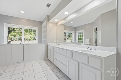 Enjoy panoramic golf course and lagoon views from this beautiful on The Landings Club - Oakridge in Georgia - for sale on GolfHomes.com, golf home, golf lot