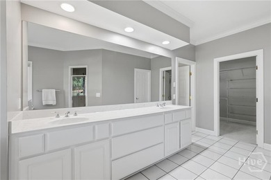 Enjoy panoramic golf course and lagoon views from this beautiful on The Landings Club - Oakridge in Georgia - for sale on GolfHomes.com, golf home, golf lot