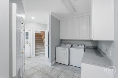 Enjoy panoramic golf course and lagoon views from this beautiful on The Landings Club - Oakridge in Georgia - for sale on GolfHomes.com, golf home, golf lot