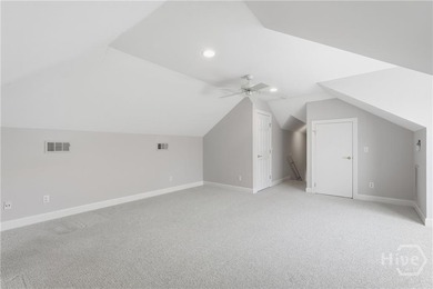 Enjoy panoramic golf course and lagoon views from this beautiful on The Landings Club - Oakridge in Georgia - for sale on GolfHomes.com, golf home, golf lot