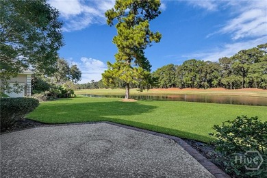 Enjoy panoramic golf course and lagoon views from this beautiful on The Landings Club - Oakridge in Georgia - for sale on GolfHomes.com, golf home, golf lot