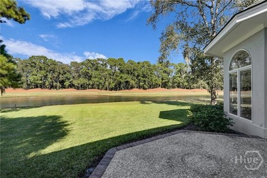 Enjoy panoramic golf course and lagoon views from this beautiful on The Landings Club - Oakridge in Georgia - for sale on GolfHomes.com, golf home, golf lot
