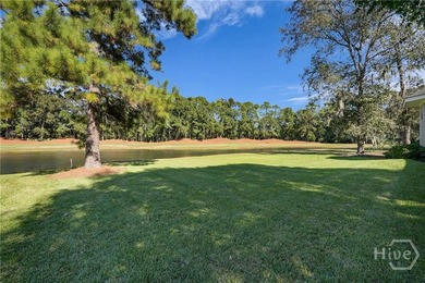 Enjoy panoramic golf course and lagoon views from this beautiful on The Landings Club - Oakridge in Georgia - for sale on GolfHomes.com, golf home, golf lot