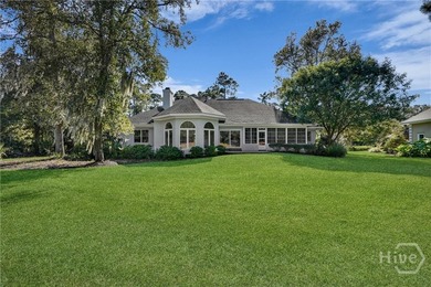 Enjoy panoramic golf course and lagoon views from this beautiful on The Landings Club - Oakridge in Georgia - for sale on GolfHomes.com, golf home, golf lot
