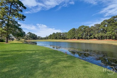 Enjoy panoramic golf course and lagoon views from this beautiful on The Landings Club - Oakridge in Georgia - for sale on GolfHomes.com, golf home, golf lot