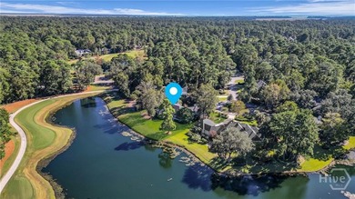 Enjoy panoramic golf course and lagoon views from this beautiful on The Landings Club - Oakridge in Georgia - for sale on GolfHomes.com, golf home, golf lot