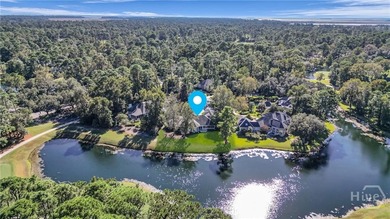 Enjoy panoramic golf course and lagoon views from this beautiful on The Landings Club - Oakridge in Georgia - for sale on GolfHomes.com, golf home, golf lot