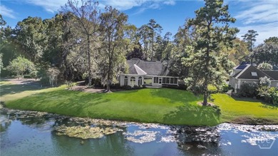 Enjoy panoramic golf course and lagoon views from this beautiful on The Landings Club - Oakridge in Georgia - for sale on GolfHomes.com, golf home, golf lot