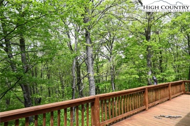 Custom built Rustic Log Home on a quiet wooded lot.  Enjoy this on Mountain Aire Golf Course in North Carolina - for sale on GolfHomes.com, golf home, golf lot