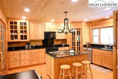 Custom built Rustic Log Home on a quiet wooded lot.  Enjoy this on Mountain Aire Golf Course in North Carolina - for sale on GolfHomes.com, golf home, golf lot