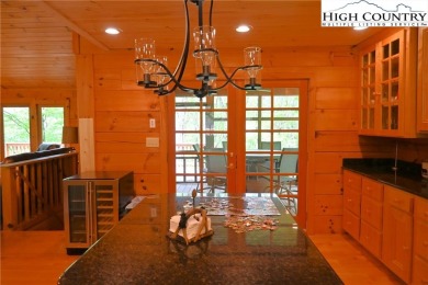 Custom built Rustic Log Home on a quiet wooded lot.  Enjoy this on Mountain Aire Golf Course in North Carolina - for sale on GolfHomes.com, golf home, golf lot