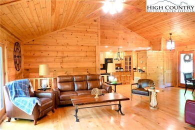 Custom built Rustic Log Home on a quiet wooded lot.  Enjoy this on Mountain Aire Golf Course in North Carolina - for sale on GolfHomes.com, golf home, golf lot