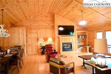 Custom built Rustic Log Home on a quiet wooded lot.  Enjoy this on Mountain Aire Golf Course in North Carolina - for sale on GolfHomes.com, golf home, golf lot