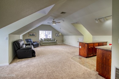 Set among towering pines on a private 0.31-acre corner lot, this on Pinetop Lakes Golf and Country Club in Arizona - for sale on GolfHomes.com, golf home, golf lot