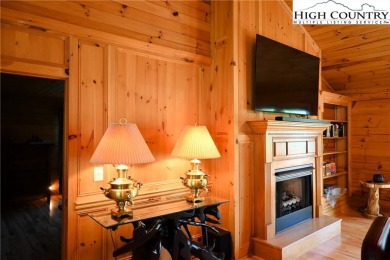 Custom built Rustic Log Home on a quiet wooded lot.  Enjoy this on Mountain Aire Golf Course in North Carolina - for sale on GolfHomes.com, golf home, golf lot