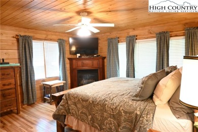 Custom built Rustic Log Home on a quiet wooded lot.  Enjoy this on Mountain Aire Golf Course in North Carolina - for sale on GolfHomes.com, golf home, golf lot