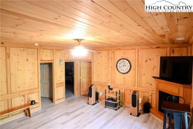 Custom built Rustic Log Home on a quiet wooded lot.  Enjoy this on Mountain Aire Golf Course in North Carolina - for sale on GolfHomes.com, golf home, golf lot