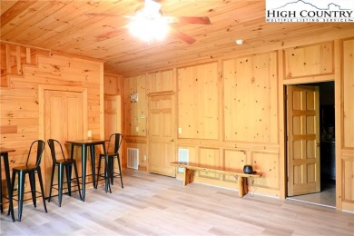 Custom built Rustic Log Home on a quiet wooded lot.  Enjoy this on Mountain Aire Golf Course in North Carolina - for sale on GolfHomes.com, golf home, golf lot