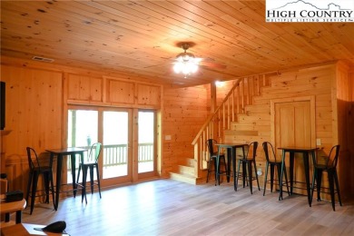 Custom built Rustic Log Home on a quiet wooded lot.  Enjoy this on Mountain Aire Golf Course in North Carolina - for sale on GolfHomes.com, golf home, golf lot