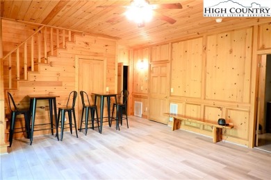 Custom built Rustic Log Home on a quiet wooded lot.  Enjoy this on Mountain Aire Golf Course in North Carolina - for sale on GolfHomes.com, golf home, golf lot