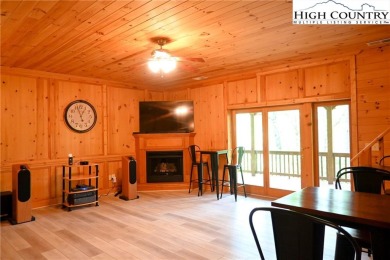 Custom built Rustic Log Home on a quiet wooded lot.  Enjoy this on Mountain Aire Golf Course in North Carolina - for sale on GolfHomes.com, golf home, golf lot