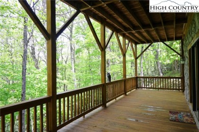 Custom built Rustic Log Home on a quiet wooded lot.  Enjoy this on Mountain Aire Golf Course in North Carolina - for sale on GolfHomes.com, golf home, golf lot