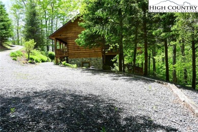 Custom built Rustic Log Home on a quiet wooded lot.  Enjoy this on Mountain Aire Golf Course in North Carolina - for sale on GolfHomes.com, golf home, golf lot