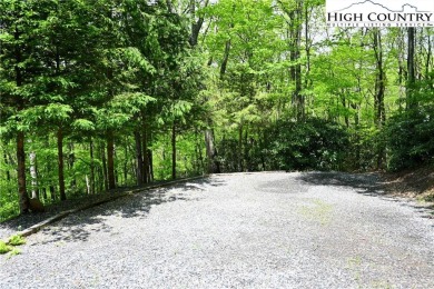 Custom built Rustic Log Home on a quiet wooded lot.  Enjoy this on Mountain Aire Golf Course in North Carolina - for sale on GolfHomes.com, golf home, golf lot