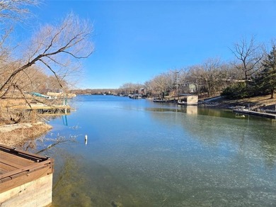 Sugar Valley Lakefront Getaway sits on double lots #79 & #80 on Sugar Valley Lakes Golf Course in Kansas - for sale on GolfHomes.com, golf home, golf lot