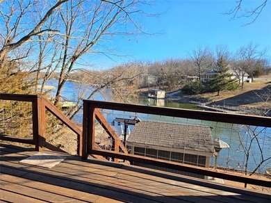 Sugar Valley Lakefront Getaway sits on double lots #79 & #80 on Sugar Valley Lakes Golf Course in Kansas - for sale on GolfHomes.com, golf home, golf lot