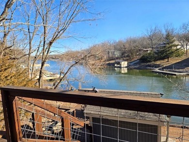 Sugar Valley Lakefront Getaway sits on double lots #79 & #80 on Sugar Valley Lakes Golf Course in Kansas - for sale on GolfHomes.com, golf home, golf lot