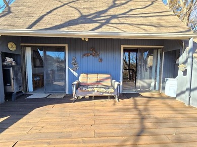 Sugar Valley Lakefront Getaway sits on double lots #79 & #80 on Sugar Valley Lakes Golf Course in Kansas - for sale on GolfHomes.com, golf home, golf lot