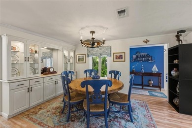 This tropical oasis features an updated interior, lush on Riviera Golf Club in Florida - for sale on GolfHomes.com, golf home, golf lot