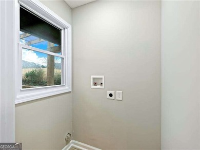 Exceptionally Renovated Four-Sided Brick Ranch On A Quiet Street on East Lake Golf Club in Georgia - for sale on GolfHomes.com, golf home, golf lot