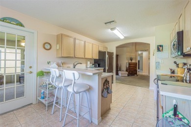 An incredibly priced three bedroom, two bath home in the on Tampa Bay Golf and Country Club in Florida - for sale on GolfHomes.com, golf home, golf lot