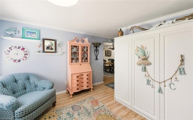 This tropical oasis features an updated interior, lush on Riviera Golf Club in Florida - for sale on GolfHomes.com, golf home, golf lot