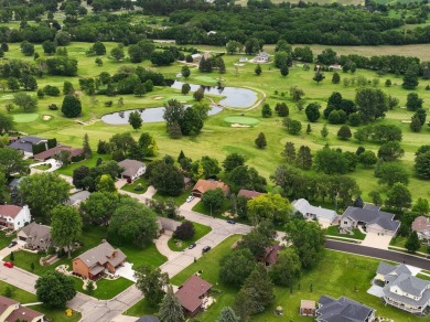 Welcome to your dream home just a block away from the serene on Monroe Country Club in Wisconsin - for sale on GolfHomes.com, golf home, golf lot