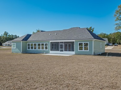 Move-in Ready! Exquisite new construction overlooking hole 6 of on Wildwood Country Club in Florida - for sale on GolfHomes.com, golf home, golf lot