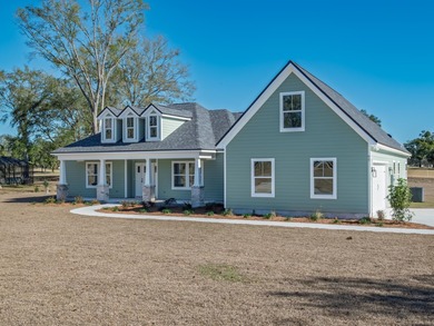 Move-in Ready! Exquisite new construction overlooking hole 6 of on Wildwood Country Club in Florida - for sale on GolfHomes.com, golf home, golf lot