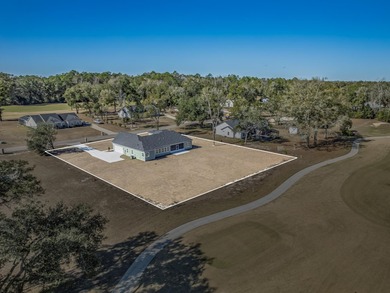 Move-in Ready! Exquisite new construction overlooking hole 6 of on Wildwood Country Club in Florida - for sale on GolfHomes.com, golf home, golf lot