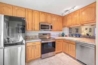 Best location in Pelican Pointe! First floor 2Be/2Ba corner unit on Pelican Pointe 9 Hole Course in Florida - for sale on GolfHomes.com, golf home, golf lot