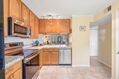 Best location in Pelican Pointe! First floor 2Be/2Ba corner unit on Pelican Pointe 9 Hole Course in Florida - for sale on GolfHomes.com, golf home, golf lot