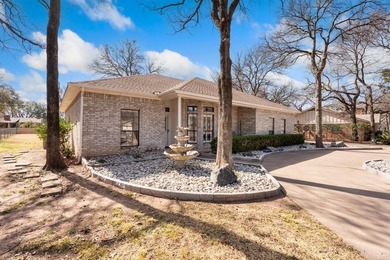 This clean, single-story brick home sits on a large lot and on De Cordova Bend Country Club in Texas - for sale on GolfHomes.com, golf home, golf lot