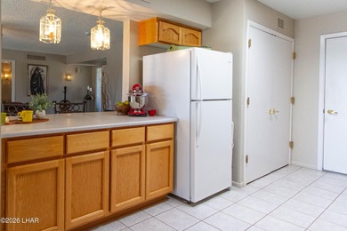 The spacious open floor plan allows you to enjoy the green on London Bridge Golf Course in Arizona - for sale on GolfHomes.com, golf home, golf lot